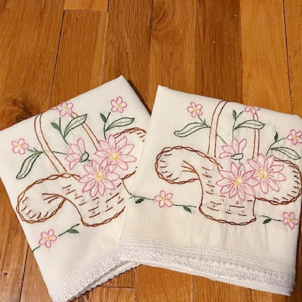 Vintage pair of pillowcases, basket and floral embroidery
